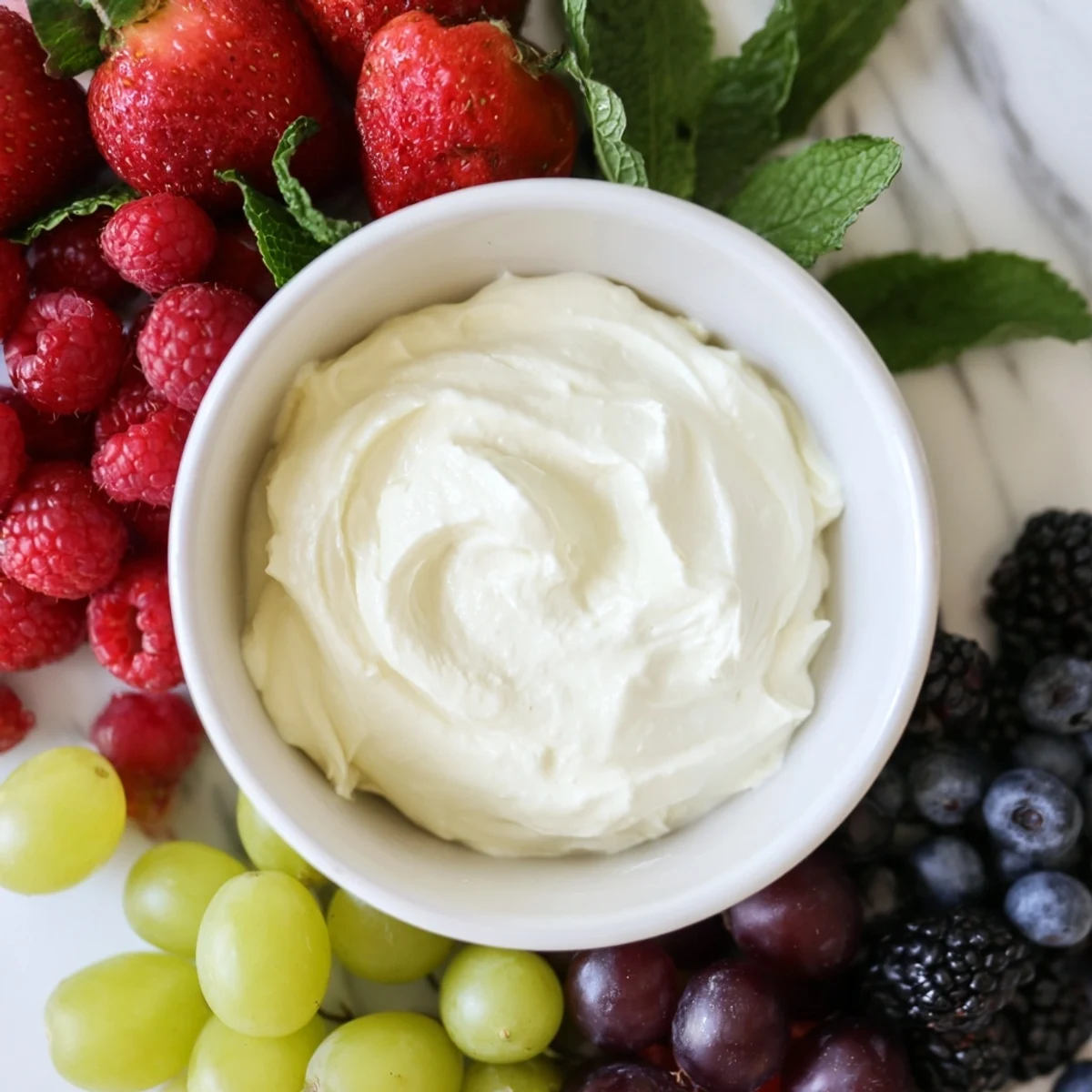 Mistletoe Kiss Berry Dip Board: a colorful holiday dessert board brimming with fresh berries and creamy dip.