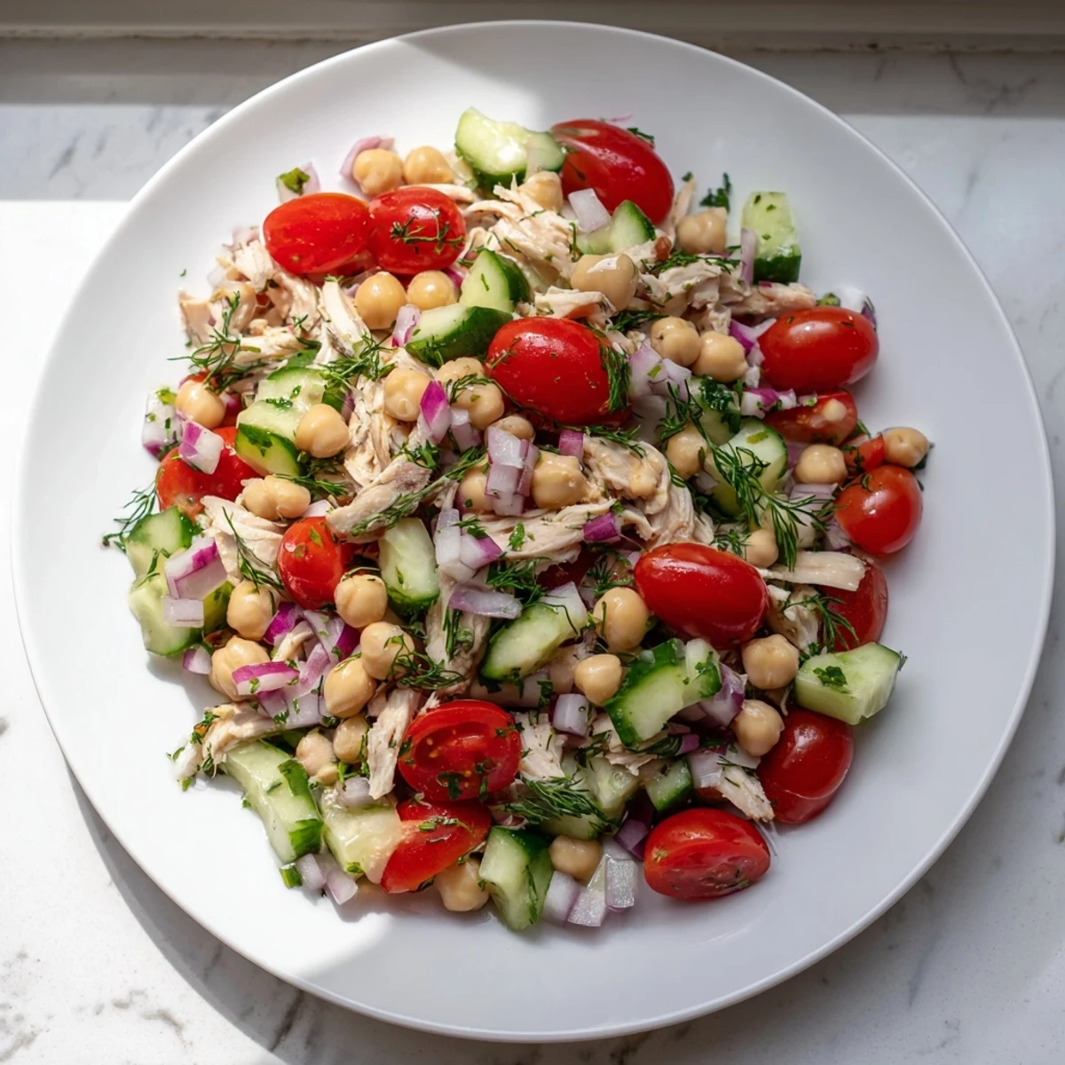 Hearty Dense Bean Salad with Lemon-Dill Chicken—a refreshing, high-protein meal perfect for a summer gathering.