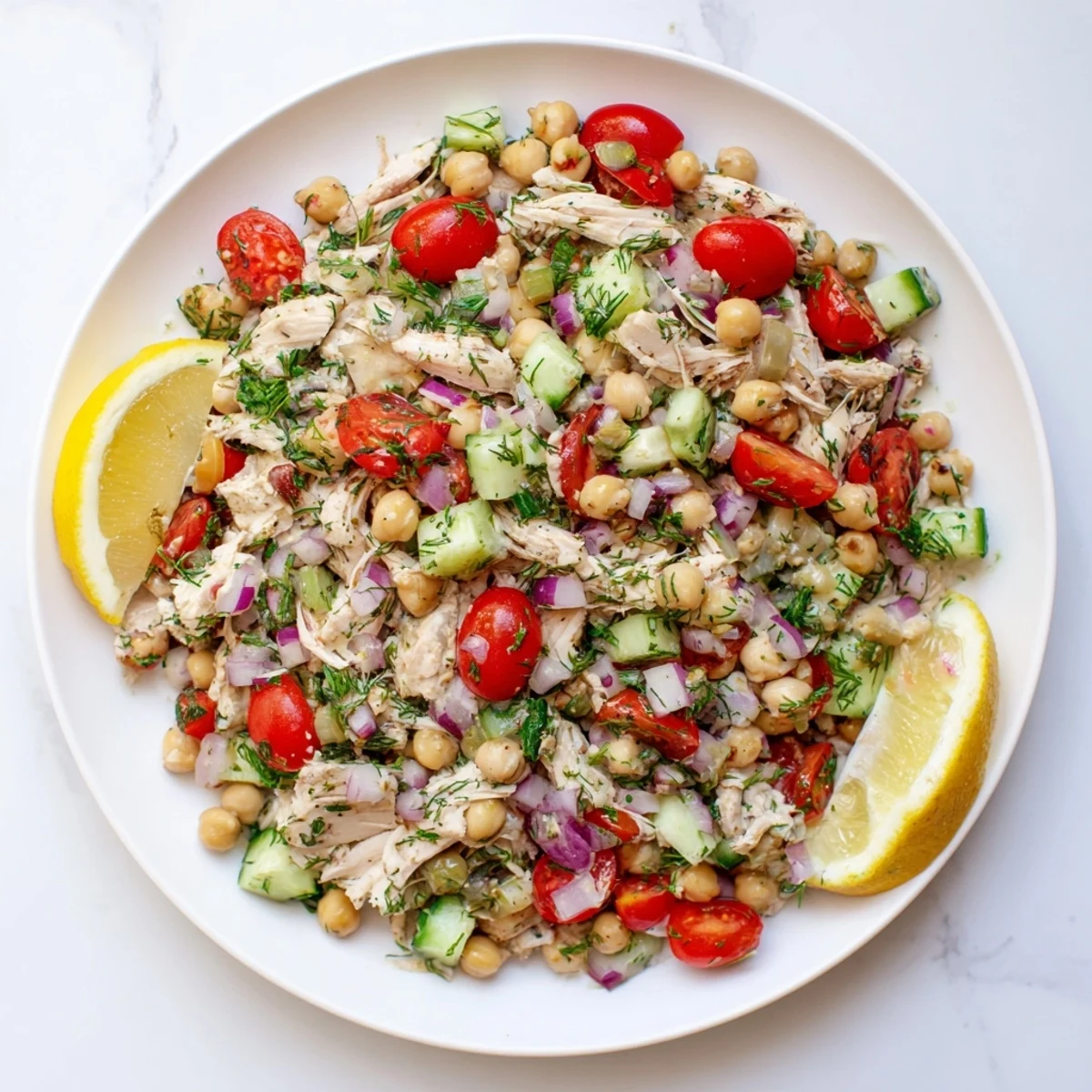 Close-up of a flavorful Dense Bean Salad with Lemon-Dill Chicken, tossed with a zesty lemon vinaigrette.
