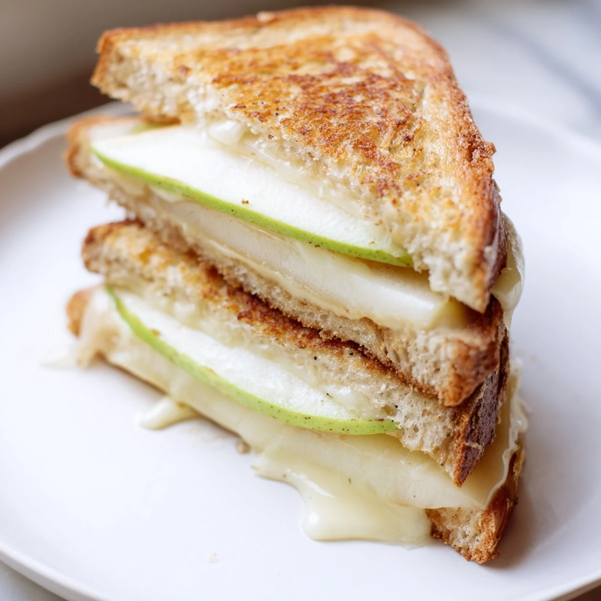 Crisp apple and creamy Brie beautifully layered inside a perfectly toasted grilled cheese sandwich.