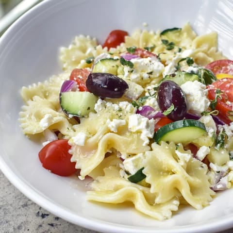 This chilled Mediterranean Olive Oil and Feta Pasta Salad features crumbled feta and Kalamata olives.