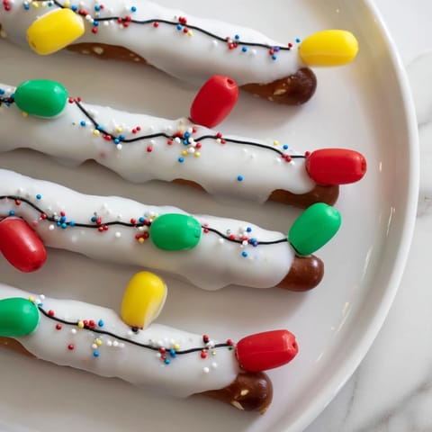 Festive No-Bake Pretzel Sticks and Dip Christmas Lights: colorful candy melts create a bright holiday snack image.