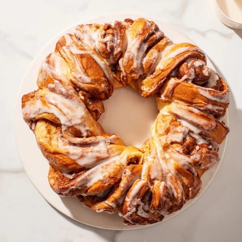 This homemade cinnamon roll pull-apart wreath offers a delightful combination of textures and aromas.