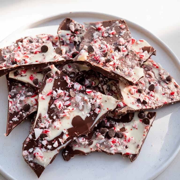 Cool, crisp Peppermint Bark showcasing layers of dark and white chocolate, and crushed peppermint.