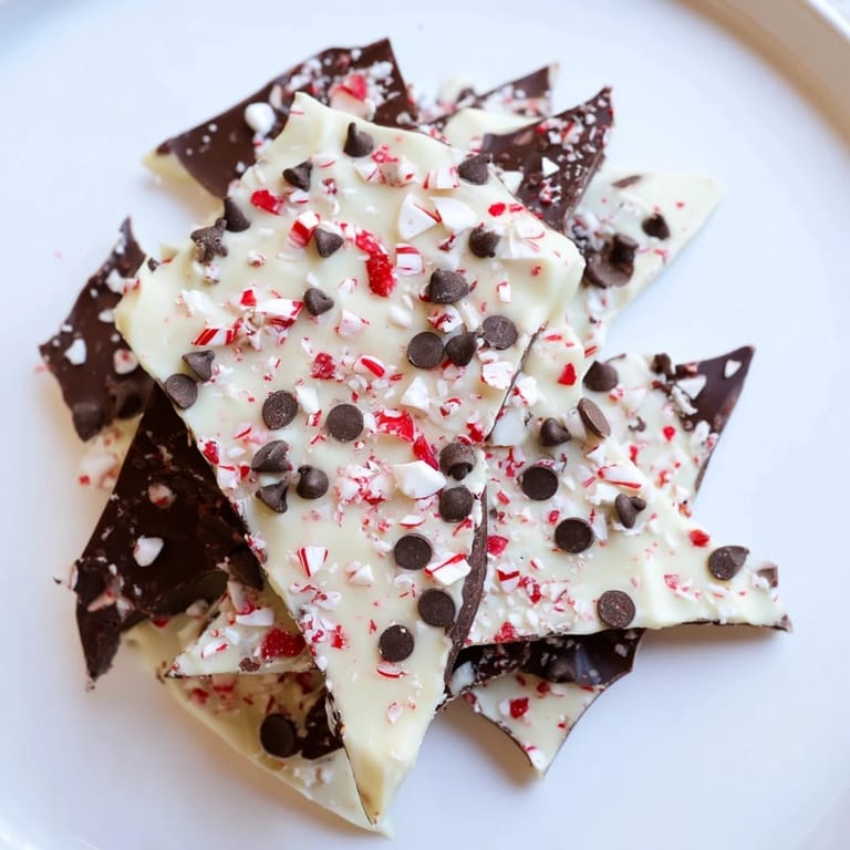 Homemade Peppermint Bark dessert, a delicious combination of chocolate, peppermint, served as shards.