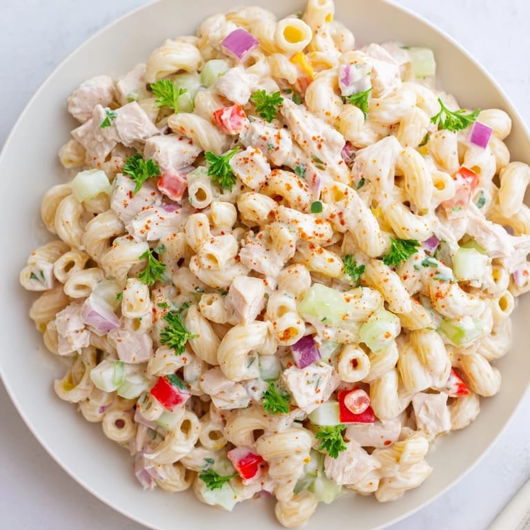 Vibrant image of Chicken Macaroni Holiday Salad, featuring a festive twist on a classic picnic food.