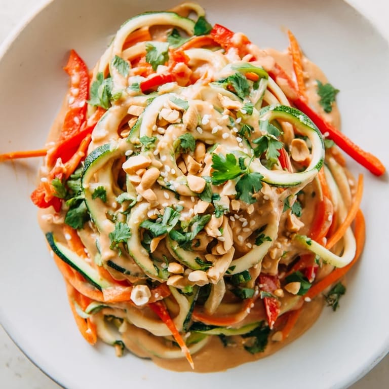 Enjoy light and healthy Zesty Peanut Zucchini Noodles salad, loaded with crunchy vegetables for lunch.