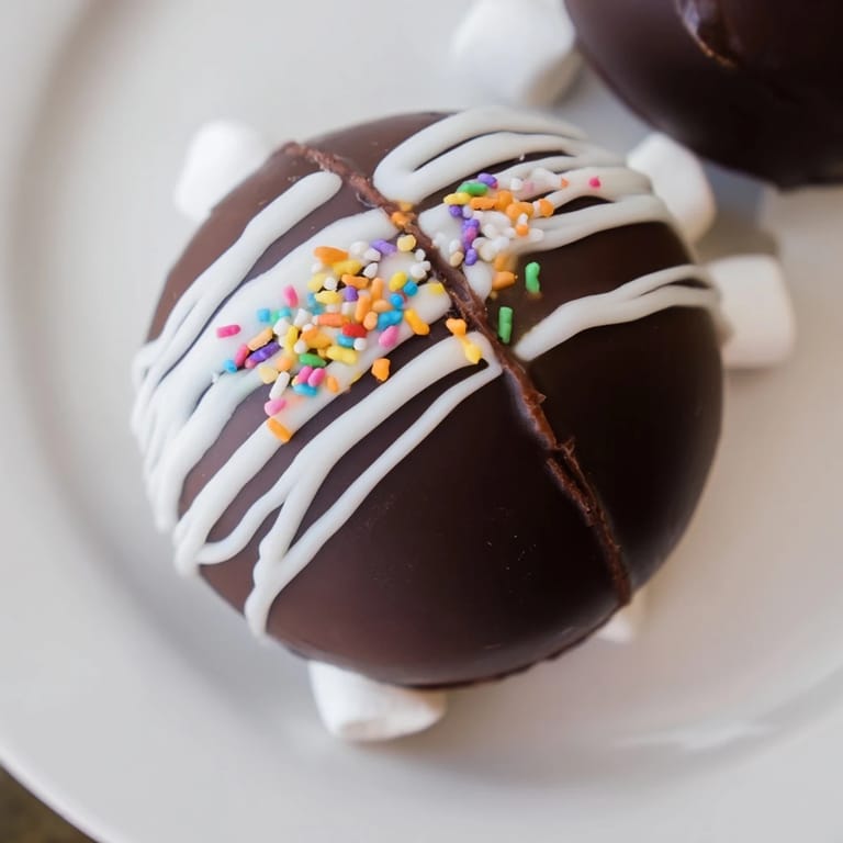 A close-up view of Hot Chocolate Bombs featuring decorative sprinkles and a rich cocoa filling inside.